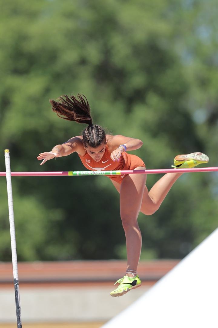 Sophia Kowalski clears the bar in the pole vault for Texas